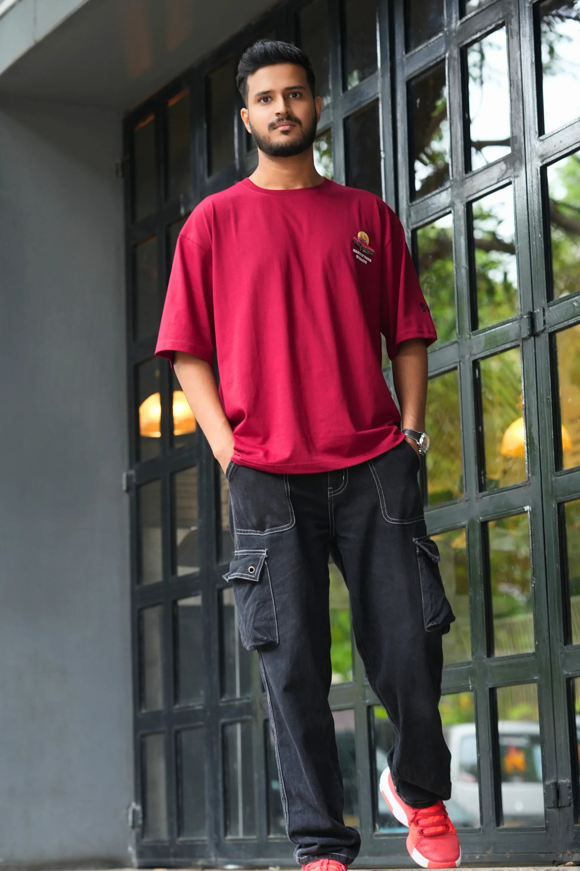 Model wearing Mustang Crimson Dept red oversized tee by Cooleo