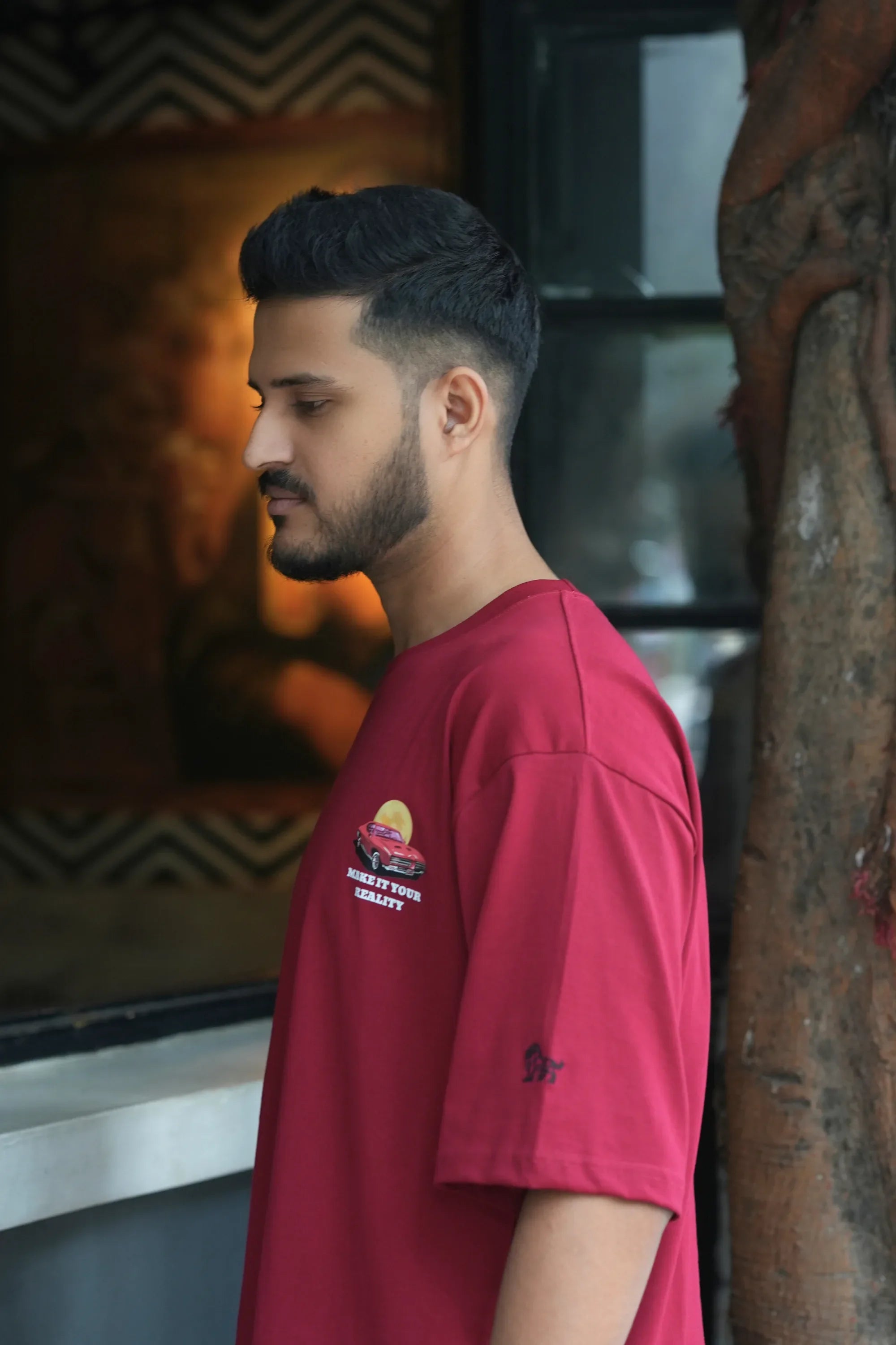 Side view of Mustang Crimson Dept red oversized streetwear tee – Cooleo