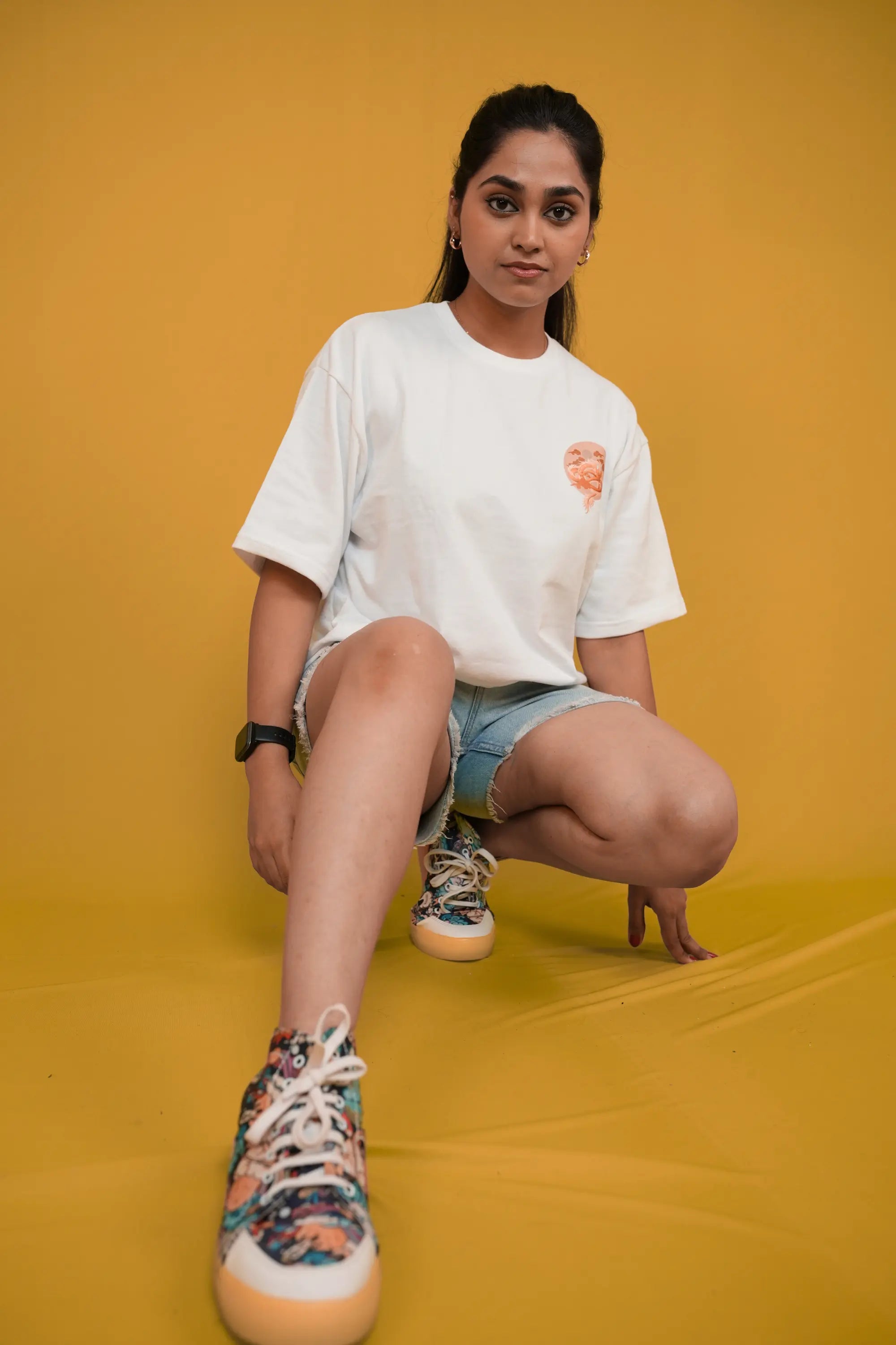 Model wearing Snowbound Dragon off‑white oversized tee by Cooleo