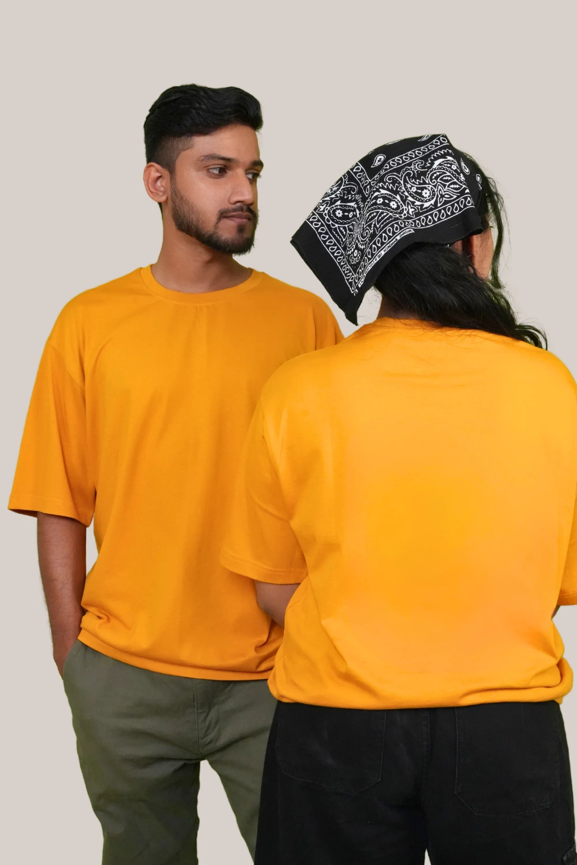 Model wearing Golden Hour yellow oversized tee by Cooleo India