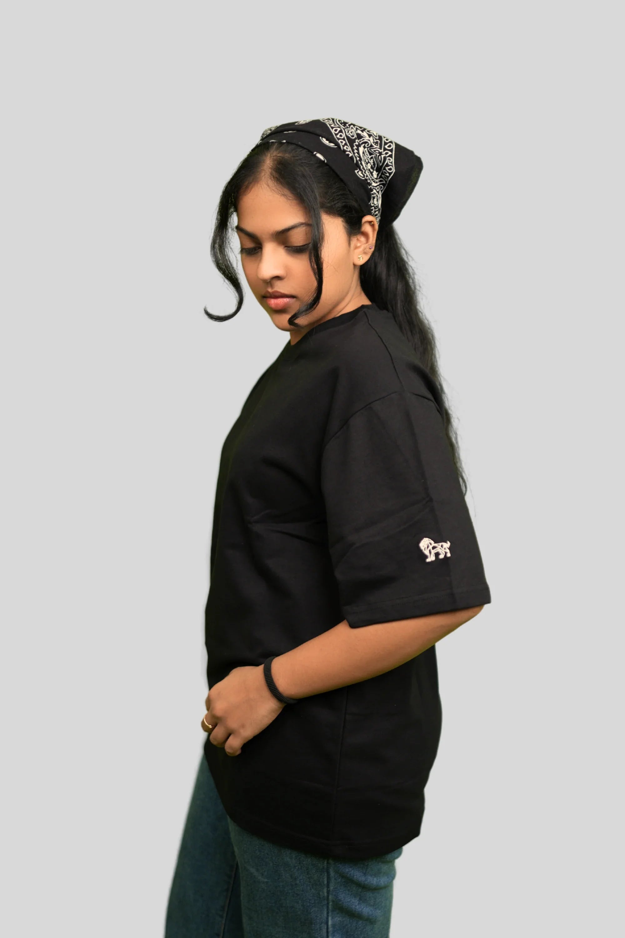 Model wearing Midnight Luxe black oversized streetwear tee by Cooleo