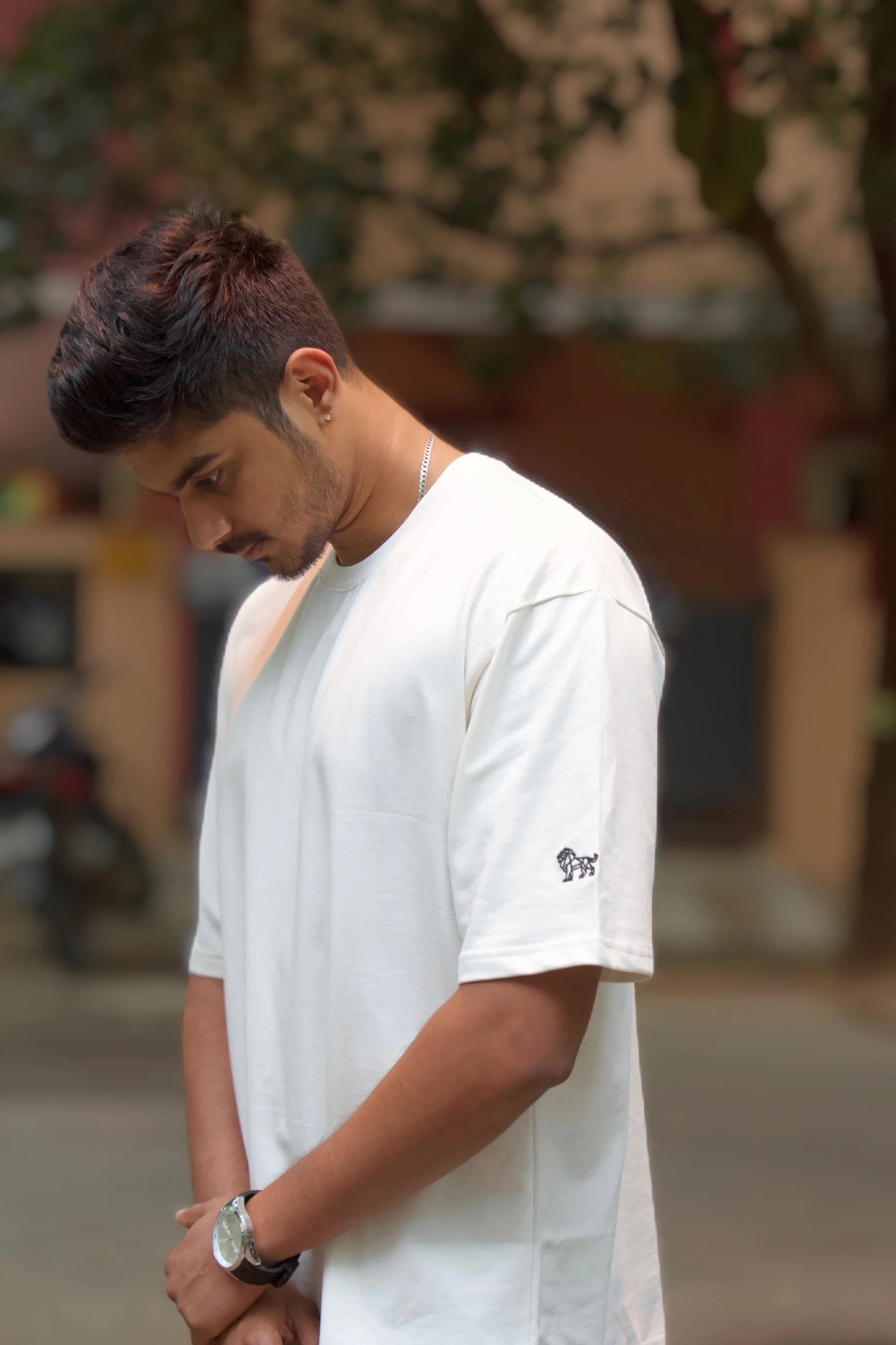 Side view of Opal Mist off‑white oversized streetwear tee – Cooleo
