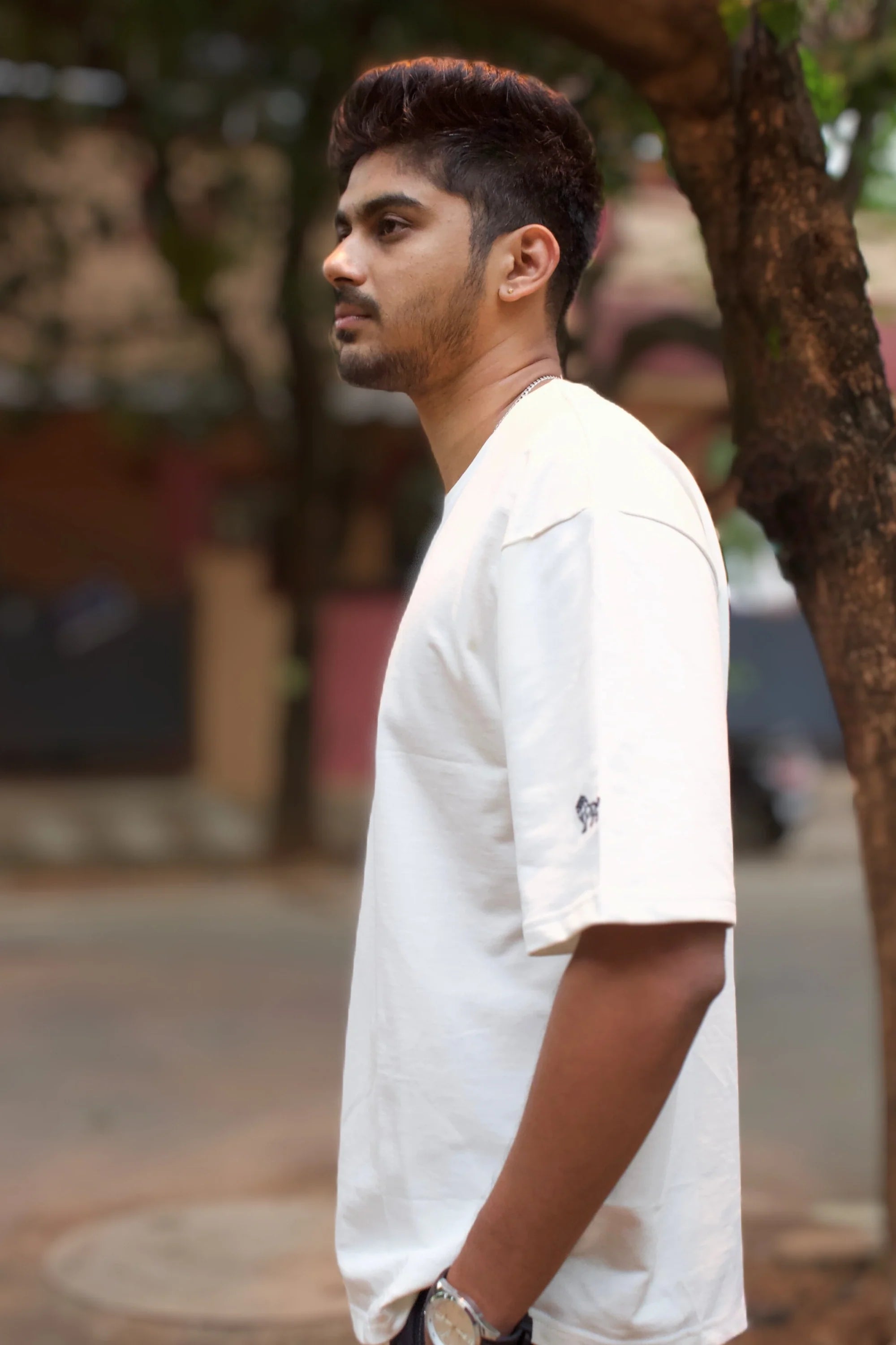 Model wearing Opal Mist off‑white oversized streetwear t-shirt – Cooleo